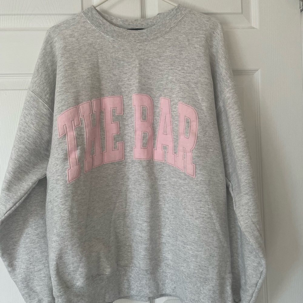 The Bar Gray Sweatshirt with Pink Lettering